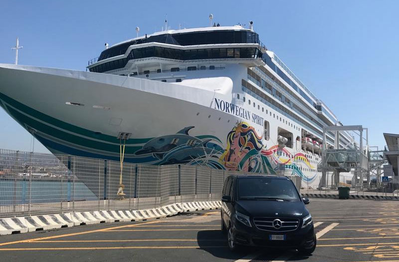 Civitavecchia transfers. Mercedes van at cruise terminal with Norwegian Spirit cruise ship. Port transfer services.