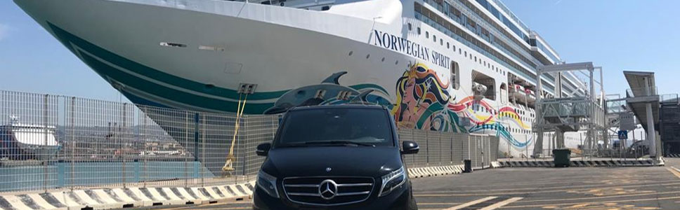 Civitavecchia transfers. Black Mercedes van at port with Norwegian Spirit cruise ship. Private car service.